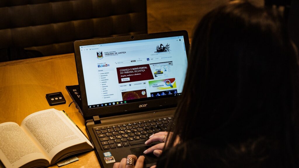 person using black laptop computer